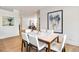 Bright dining room features a modern table setting and contemporary art at 2575 Peachtree Ne Rd # 6G, Atlanta, GA 30305