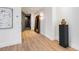 Hallway featuring hardwood floors, modern art, and a decorative mirror at 2575 Peachtree Ne Rd # 6G, Atlanta, GA 30305