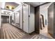 Modern hallway with stylish patterned carpeting, contemporary mirrors and light fixtures, and doors leading to rooms at 2575 Peachtree Ne Rd # 6G, Atlanta, GA 30305