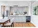 Modern kitchen features sleek gray cabinetry, stainless steel appliances, and marble countertops at 2575 Peachtree Ne Rd # 6G, Atlanta, GA 30305