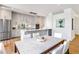 Open-concept kitchen with stainless steel appliances and marble countertops next to a dining area at 2575 Peachtree Ne Rd # 6G, Atlanta, GA 30305