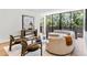 Elegant living room featuring modern furniture, hardwood floors, and large windows at 2575 Peachtree Ne Rd # 6G, Atlanta, GA 30305