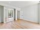 Spacious living area with sliding doors to a balcony and adjacent bedroom and bathroom at 2575 Peachtree Ne Rd # 6G, Atlanta, GA 30305