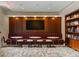 Comfortable lounge area with plush seating, tables, a large screen TV, and a well-stocked bookshelf for relaxation at 2575 Peachtree Ne Rd # 6G, Atlanta, GA 30305