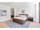 Stylish main bedroom with wood-look platform bed and modern decor at 2575 Peachtree Ne Rd # 6G, Atlanta, GA 30305