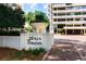 Close up of Plaza Towers sign with manicured landscaping and building visible in the background at 2575 Peachtree Ne Rd # 6G, Atlanta, GA 30305