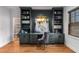 Bright home office features built-in shelves and hardwood floors at 3018 Eamont Ter, Atlanta, GA 30328