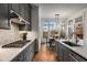 Kitchen features gray cabinets, quartz countertops and a large window at 3018 Eamont Ter, Atlanta, GA 30328