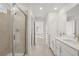 Main bathroom with double vanity, quartz countertop and walk-in shower at 8 Tallulah Trl, Sharpsburg, GA 30277