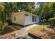 Side view of a white house with walkway at 1355 Woodland Sw Dr, Oxford, GA 30054