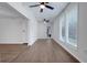 Bright living room with hardwood floors, large windows, and white walls at 1355 Woodland Sw Dr, Oxford, GA 30054