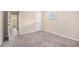 Bedroom with neutral carpet, natural light, and a doorway to other rooms at 2318 Ousley Ct, Decatur, GA 30032