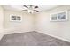 Cozy bedroom with neutral walls and carpet floors, illuminated by a ceiling fan at 2318 Ousley Ct, Decatur, GA 30032