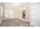 Carpeted bedroom with neutral walls, a closet, and a ceiling light at 2318 Ousley Ct, Decatur, GA 30032
