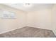Bright bedroom featuring carpet floors, neutral walls, and natural light at 2318 Ousley Ct, Decatur, GA 30032