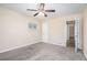 Bedroom with ceiling fan, natural light, and neutral carpet at 2318 Ousley Ct, Decatur, GA 30032