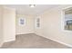 Cozy bedroom featuring carpet floors, neutral walls, and natural light at 2318 Ousley Ct, Decatur, GA 30032