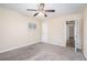 This cozy carpeted bedroom features neutral walls and natural light from a window at 2318 Ousley Ct, Decatur, GA 30032