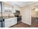 Modern kitchen featuring stainless steel appliances, granite countertops, and white cabinetry at 2318 Ousley Ct, Decatur, GA 30032
