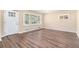 Bright living room featuring new floors, neutral walls, and multiple windows at 2318 Ousley Ct, Decatur, GA 30032