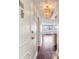 Inviting condo entryway with attractive light fixture and hardwood floors leads to a bright living space at 2479 Peachtree Ne Rd # 1012, Atlanta, GA 30305