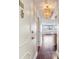 Condo entryway featuring hardwood floors and modern light fixture at 2479 Peachtree Ne Rd # 1012, Atlanta, GA 30305