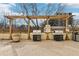 Outdoor grilling area featuring two stainless steel gas grills under a covered wooden pergola at 2479 Peachtree Ne Rd # 1012, Atlanta, GA 30305