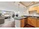 Modern kitchen and open living space with granite countertops and stainless steel appliances provides views of the cityscape at 2479 Peachtree Ne Rd # 1012, Atlanta, GA 30305