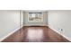 Well-lit living room with hardwood floors and views of the city skyline from the window at 2479 Peachtree Ne Rd # 1012, Atlanta, GA 30305