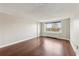 Bright living room features hardwood floors and a large window with city views at 2479 Peachtree Ne Rd # 1012, Atlanta, GA 30305