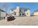Back exterior view showcasing the two-story home and the expansive backyard at 3120 Esplanade Sw Cir, Atlanta, GA 30311