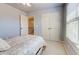 Well-lit bedroom features a large closet, a window, and neutral wall color at 3120 Esplanade Sw Cir, Atlanta, GA 30311