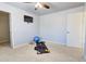 Bright bonus room with fitness equipment and a TV for entertainment at 3120 Esplanade Sw Cir, Atlanta, GA 30311