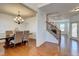 Traditional dining room with hardwood floors, elegant chandelier, and classic wainscoting for a sophisticated dining experience at 3120 Esplanade Sw Cir, Atlanta, GA 30311