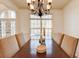 An interior photo of a dining room space, featuring an ornate chandelier and large window at 3120 Esplanade Sw Cir, Atlanta, GA 30311