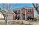 Brick two-story house with a three-car garage and landscaping at 3120 Esplanade Sw Cir, Atlanta, GA 30311