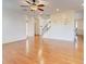Large living room with hardwood floors and modern ceiling fan fixture at 3120 Esplanade Sw Cir, Atlanta, GA 30311