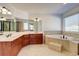 Bright main bathroom with double vanity, soaking tub, and neutral finishes at 3120 Esplanade Sw Cir, Atlanta, GA 30311