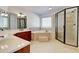 Main bathroom features a double vanity, soaking tub, and glass enclosed shower at 3120 Esplanade Sw Cir, Atlanta, GA 30311