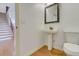 Small powder room with pedestal sink and hardwood floor at 3120 Esplanade Sw Cir, Atlanta, GA 30311