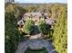 Grand estate home with circular driveway, landscaping, and city views at 3450 Ridgewood Nw Rd, Atlanta, GA 30327