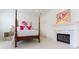 Elegant bedroom with a fireplace and four poster bed at 3450 Ridgewood Nw Rd, Atlanta, GA 30327