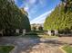 Impressive gated entrance to an estate home with a large lawn at 3450 Ridgewood Nw Rd, Atlanta, GA 30327