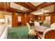 Game room with wood-paneled walls, a round table and chairs at 3450 Ridgewood Nw Rd, Atlanta, GA 30327