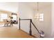 Elegant staircase with chandelier and view into living area at 3450 Ridgewood Nw Rd, Atlanta, GA 30327