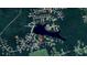 Aerial view shows property's proximity to lake and surrounding wooded area at 45 Kinloch Ct, Covington, GA 30014
