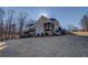 Gorgeous backyard featuring a spacious deck, screened porch, and mature trees at 45 Kinloch Ct, Covington, GA 30014