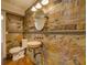 Unique bathroom featuring custom stone work, stylish fixtures and lustrous floor at 45 Kinloch Ct, Covington, GA 30014