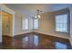 Bright dining room featuring a stylish chandelier, and lustrous floors at 45 Kinloch Ct, Covington, GA 30014