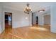 Open dining space showcasing hardwood floors, elegant trim, and seamless flow to other rooms at 45 Kinloch Ct, Covington, GA 30014